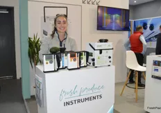 Kendra Ellertson with Felix Instruments. Kendra proudly shows a number of Fruit Quality Meters as well as an ethylene generator from Catalytic Generators.